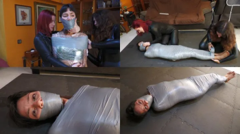 Spanish Ties - Mayla mummified by the catsuit burglars!.webp
