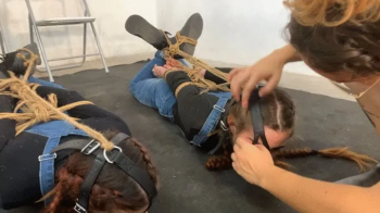 Bakcstage removing ropes to Laura and Kate.webp