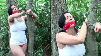 Kerri- Hippie Hitcher, Cuffed To Tree, Gagged, Jeans Pulled Down, Exposed Panties.webp