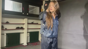 Marie Mueller bound and gagged in shiny nylon Rainwear.webp
