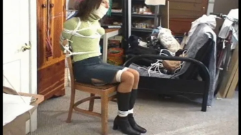 Tight ball and tape gag combo and tied to chair in her new place.webp
