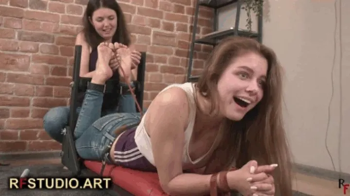 Dana tickles barefoot Leya on a special tickling device (FULL HD MP4).webp