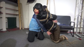 Aiyana bound, gagged and suspended in shiny nylon Downwear Part 3 of 3.webp