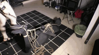 Slave in tight hogtie, totally in Mistress's hands Italian language WMV version.webp