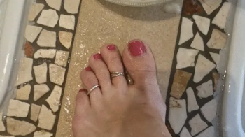 Carina is taking care of her feet with a scrub in the private spa.webp