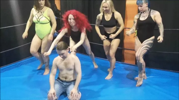 2 muscular girls and 2 female wrestlers tie up a guy in a match part 2 (young guy).webp