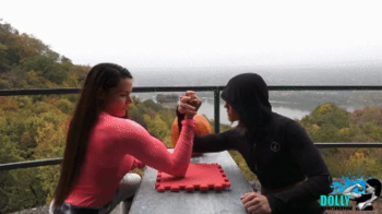 Halloween armwrestling match between 2 strong girls.webp