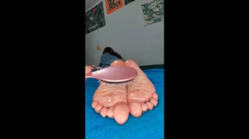 Ankles tied and my oily soles being tickled with a brush.webp