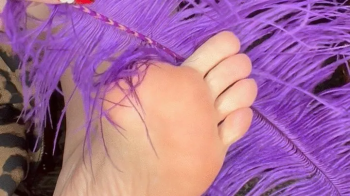 Fluffy feather foot tickles.webp