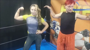 BJJ girl vs red haired guy competitive match with armbars and triangle hold.webp