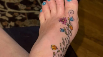 Tickling my foot with a feather.webp