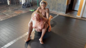 Sugar Diamond vs Sunny Ray in a topless competitive wrestling match.webp