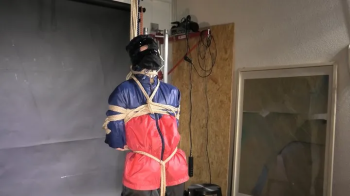 Aiyana bound, Pantygagged and Pantyhooded in shiny nylon Rainwear.webp