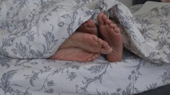 TWO PAIRS OF LEGS UNDER THE BLANKET (fp).webp