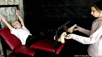 Lena cruelly tickles Angelica's very wrinkled and ticklish feet in the stocks (Part 1 of 4).webp