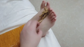 xy248-Barefoot girl mummified with yellow tape - Part 1.webp
