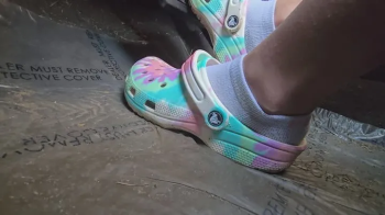 Chrissy socks and crocs in car.webp