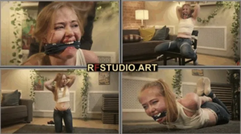 Olesya Bound by the Rigger Part 1 - Cleave Gag, Chair Tie, and Tight Hogtie (FULL HD MP4).webp
