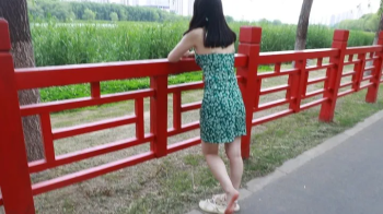 Chinese female doctor’s bare feet were tickled outdoors after get off work.webp