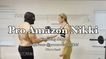 OMG! Powerful Amazon teaches the grapevine and scissors to new wrestling student! Poor fool!.webp