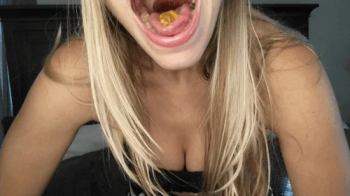 Open mouth swallowing gummy bears.webp