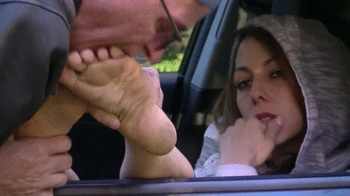 Sunny barefoot in car (HD).webp