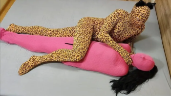 Mummified in pink bondage sack.webp