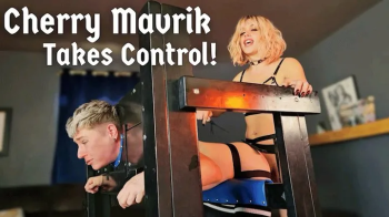 Trans domme brutally beats and fucks FtM in Pillory - Jaq Quicksilver and Cherry Mavrik - MtF dominatrix puts trans man.webp