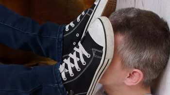 Dude is happy to feel powerful girl`s Converse sneakers on his face, g309x (slide show) 2160p.webp
