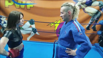 Sambo style girl vs guy in gi.webp