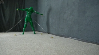 Transparent mummification of a green man in a vacuum bed.webp