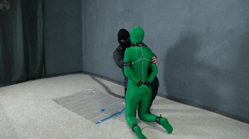 Bondage green zentai leather handcuffs in a vacuum bag.webp