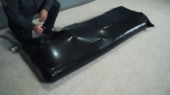 New black inflatable vacuum bed with pear gag and vibro.webp