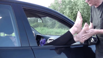 Feet out of car (HD).webp