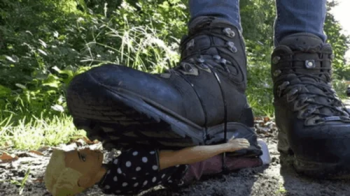 Tiny foot slave tied to my boot sole.webp
