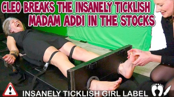 CLEO BREAKS THE INSANELY TICKLISH MADAM ADDI IN THE STOCKS - HD WMV.webp