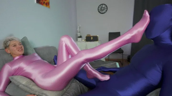 Ruslana In Pink Shiny Zentai Rubs Dick.webp