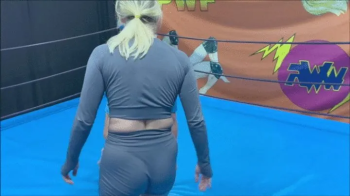 Blonde fem wrestler wrestles competitively.webp