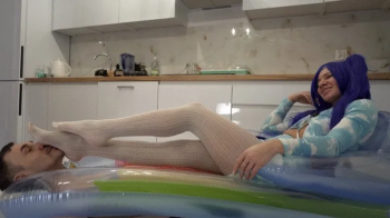 Man Under Mattress And Miku Relaxing On Him In White Pantyhose.webp