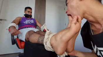 Giant Jock boy Captured to Tickling and Foot Worship.webp