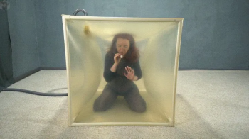 Vibro ass up in a transparent cube.webp