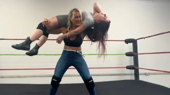 Blonde drops brunette on her head.webp