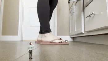 Giantess Dominates Tiny Man Under Her Feet.webp