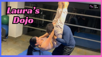 Laura shows David who owns the Dojo and the Underground Mixed Wrestling Club with her athleticism and strong thighs.webp