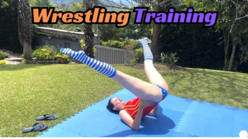 2 Girls Learn to mixed wrestle in preparation for tournament.webp
