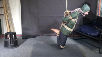 Myxxxy bound, gagged and vibed in shiny nylon Rainwear and finally suspended.webp