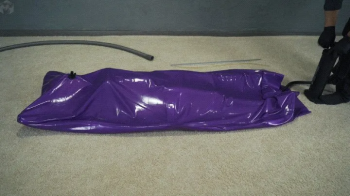 Purple vacuum bed with inflatable mattress and inflatable pear gag.webp
