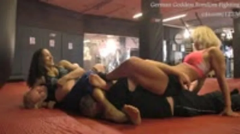 Sheena and Mme Curie in a Tag Team Match- Double Trouble Unfair Struggle.webp