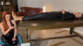 Stella Lies On Her Back In Black Suit And Weronika Tickle And Lick Her Feet In Tan Pantyhose - Tickling Part.webp