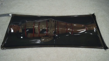 Bondage with red straps maid in black transparent bed with vibro.webp